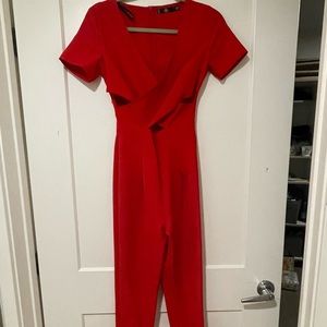 Long pants jump suit. Small v-neck. Warren one time. Fits tight.